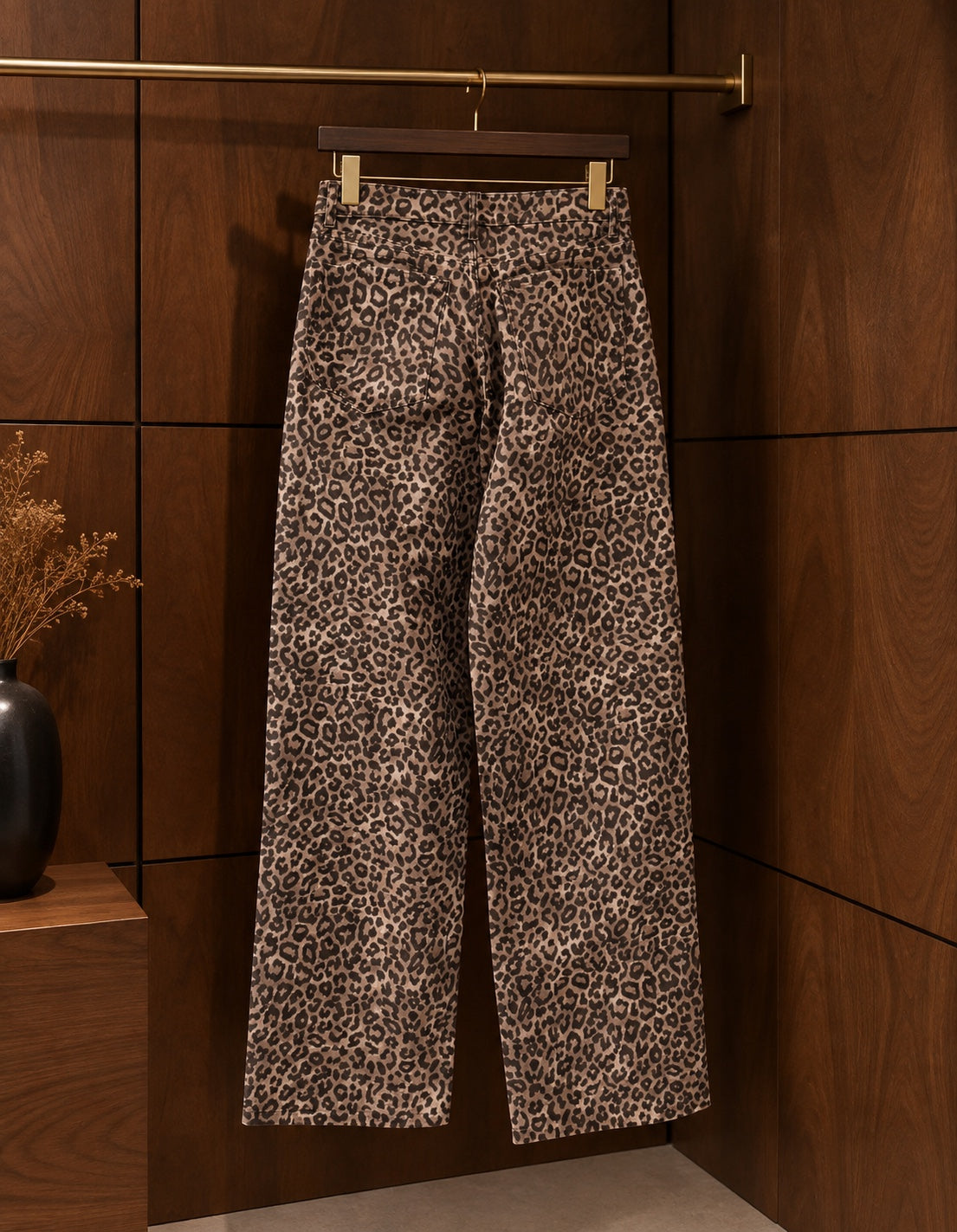 Leopard print wide-leg jeans back view on hanger