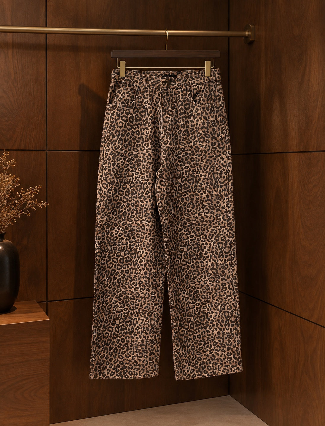 Leopard print wide-leg jeans front view on hanger
