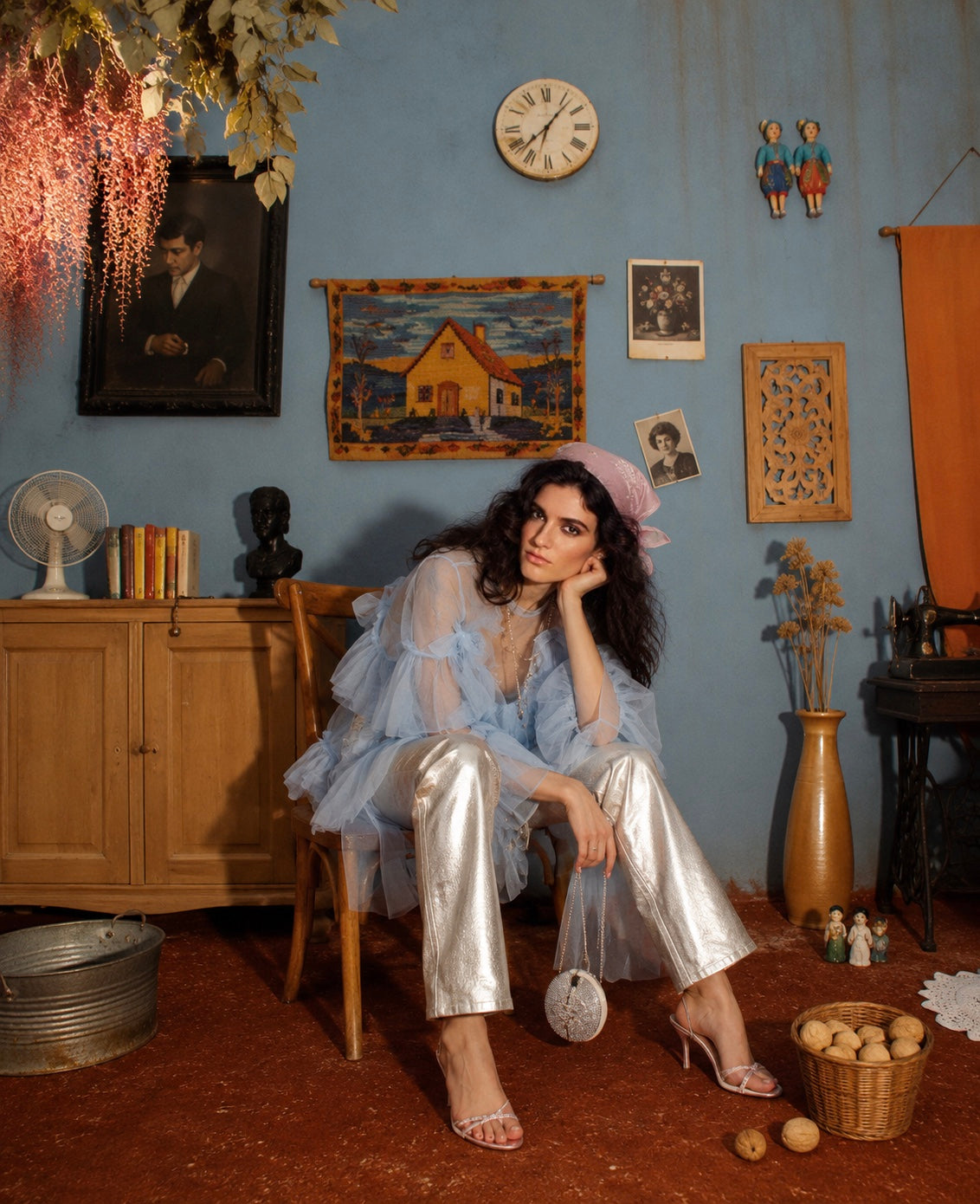 Metallic silver jeans seated editorial look